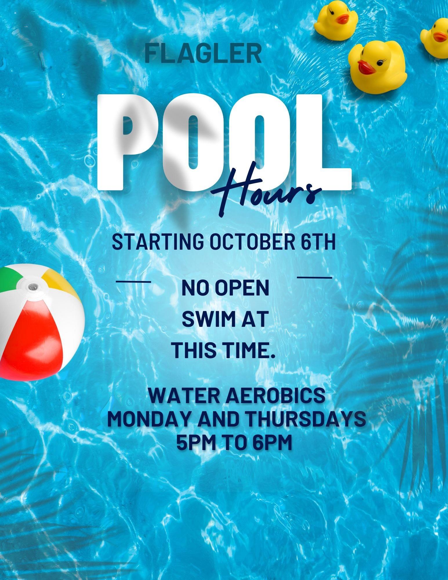 Blue & white lettering on a blue water background with three yellow rubber ducks and red, white and yellow blow up ball