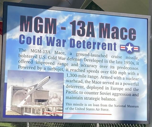 MGM-13A Mace Missile Sign, sky blue back ground, blue and black letters with photo of a missile launch